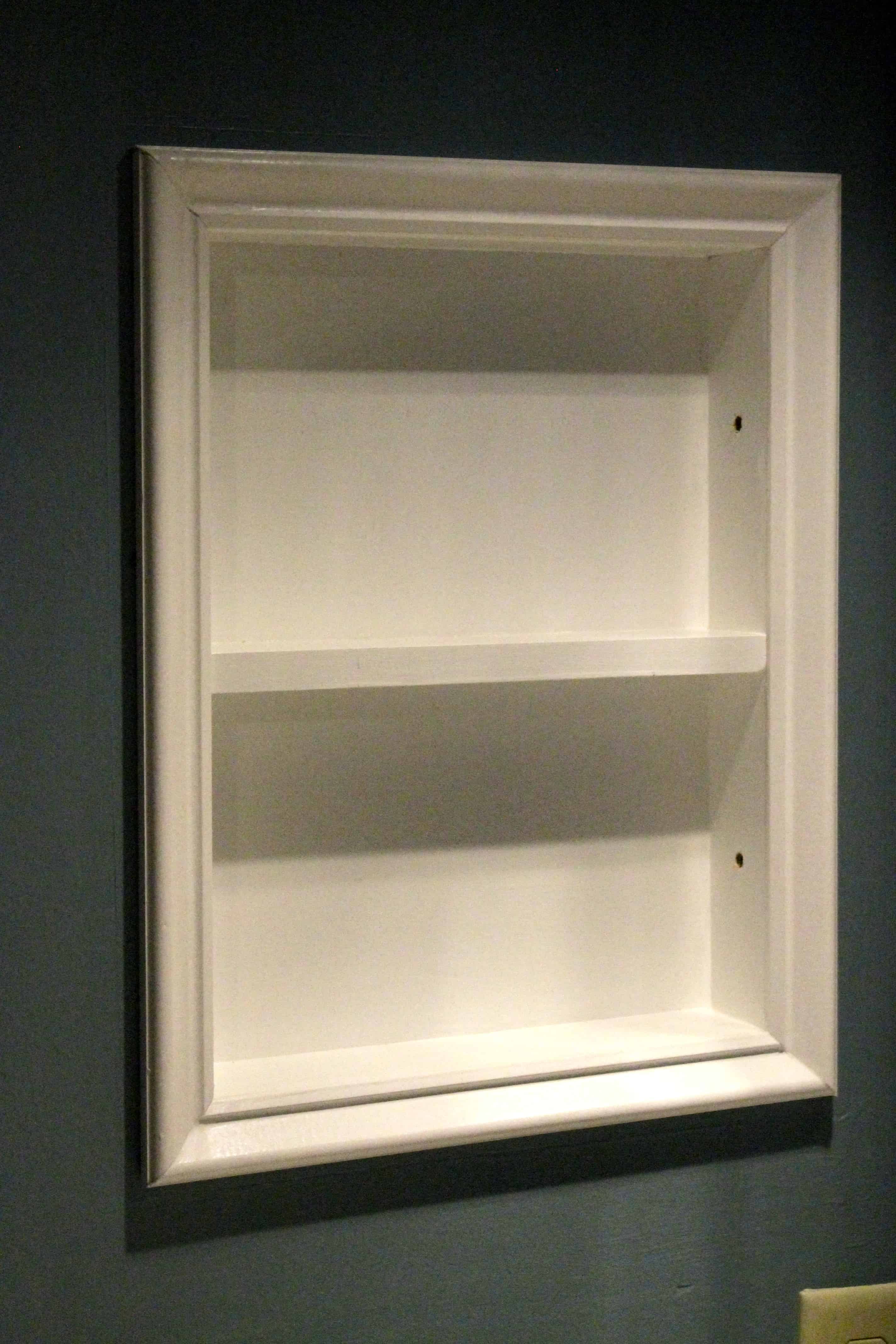 Converted metal medicine cabinet into open shelves I was