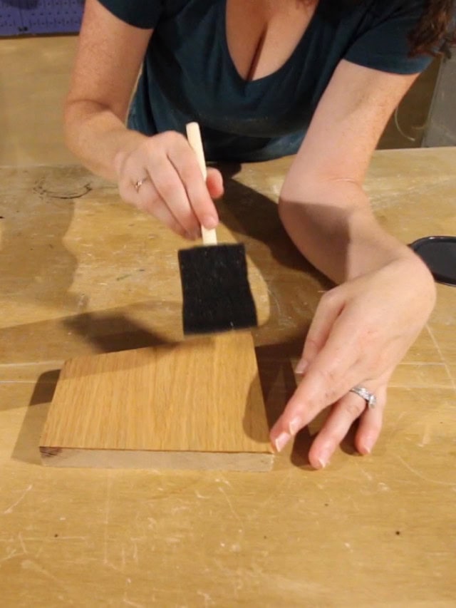 applying wood conditioner to oak wood