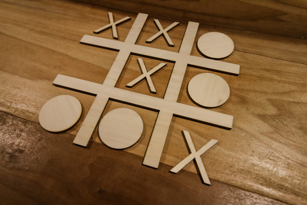 playing tic tac toe with laser cut board