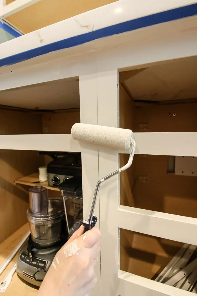 painting kitchen cabinets with a mini foam roller