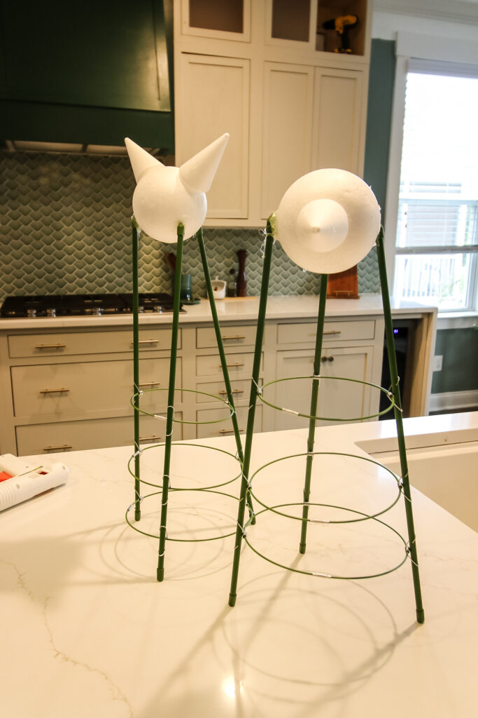 styrofoam balls and cones on a tomato cage