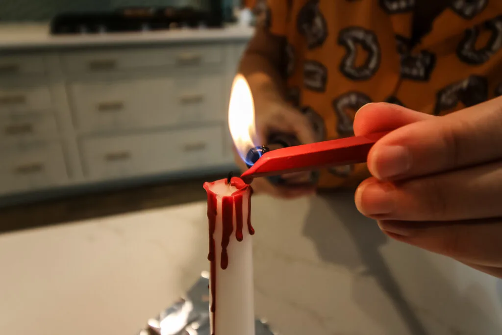 using melted crayons to create bleeding candles for halloween