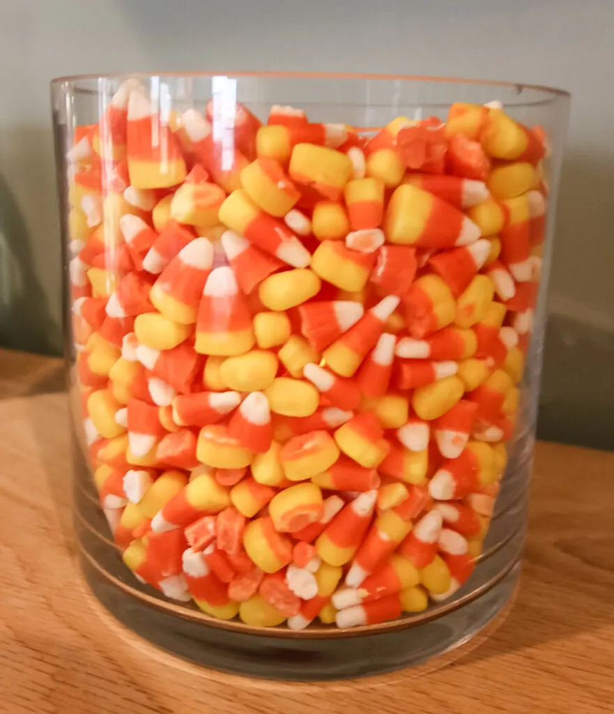 candle in a candy corn vase