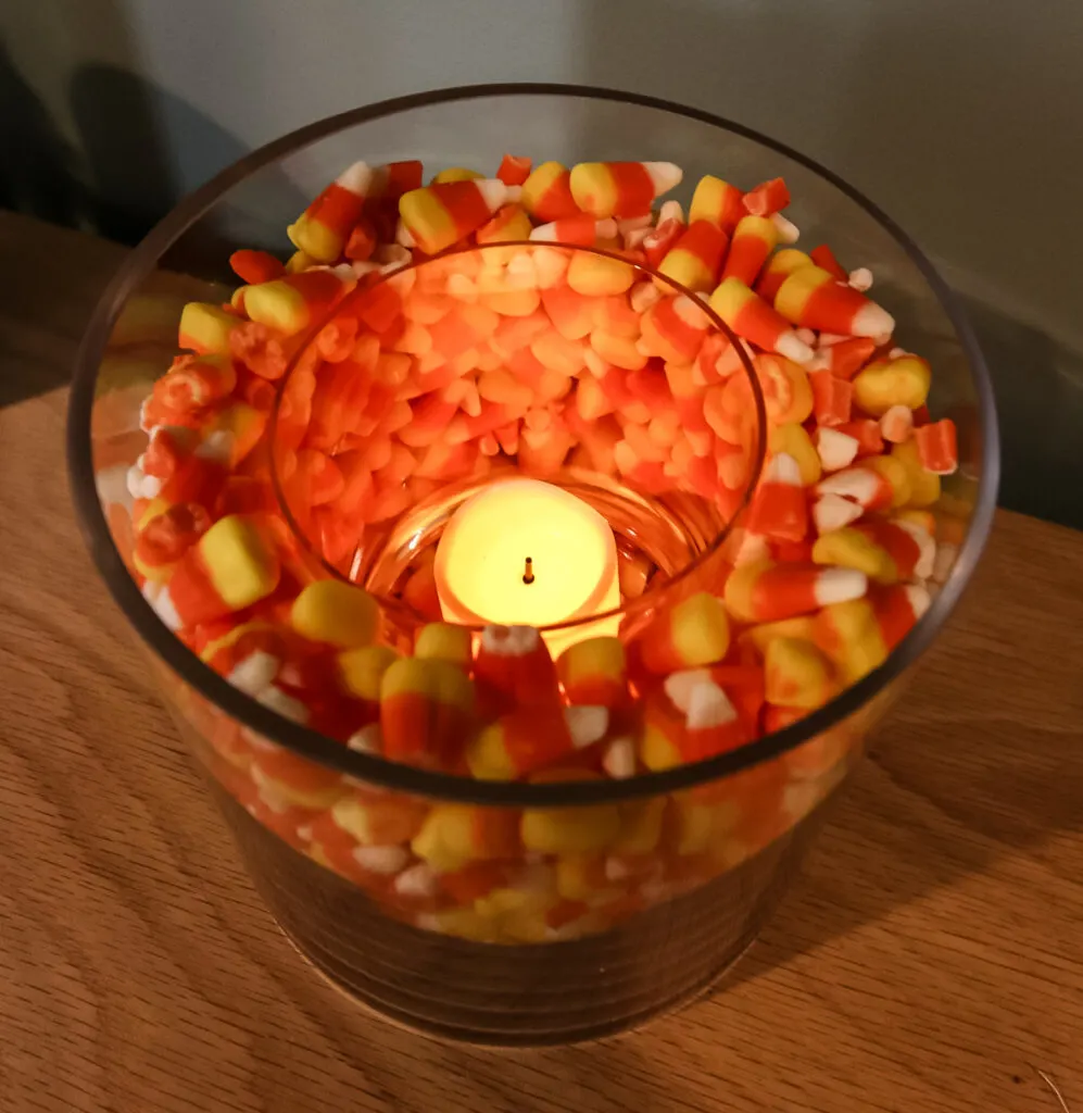 candle in a candy corn vase