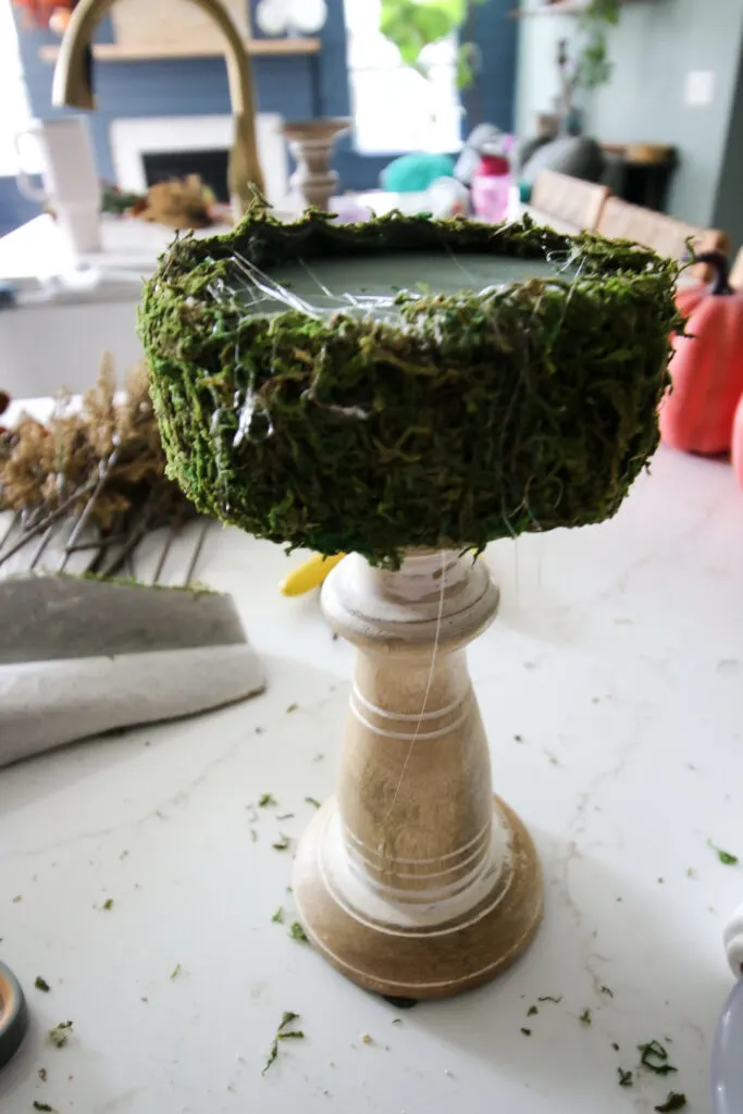 moss hot glued to candlestick