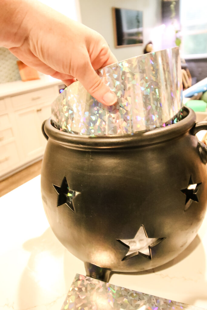 adding holographic paper to a cauldron