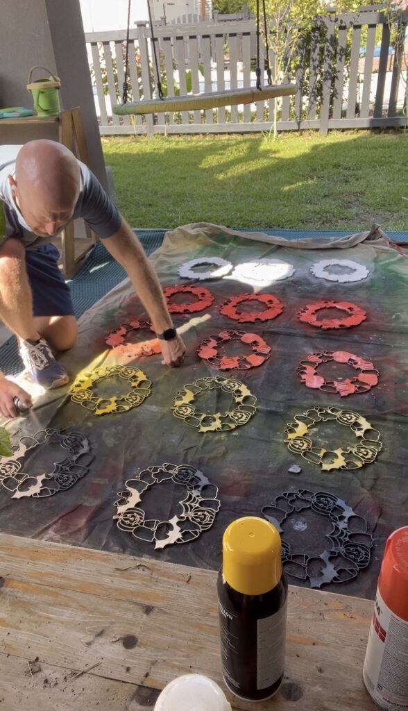 Spray painting Halloween wreaths