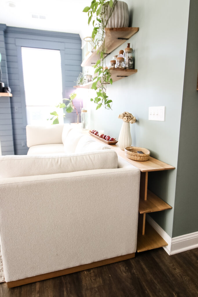 Sofa table between couch and wall