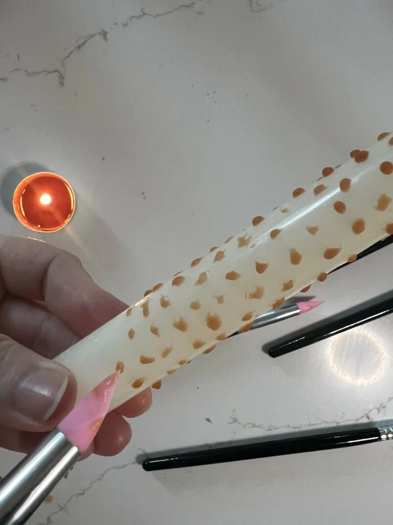 painting candles with wax