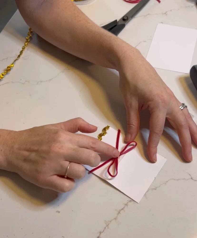 adding bow to place cards