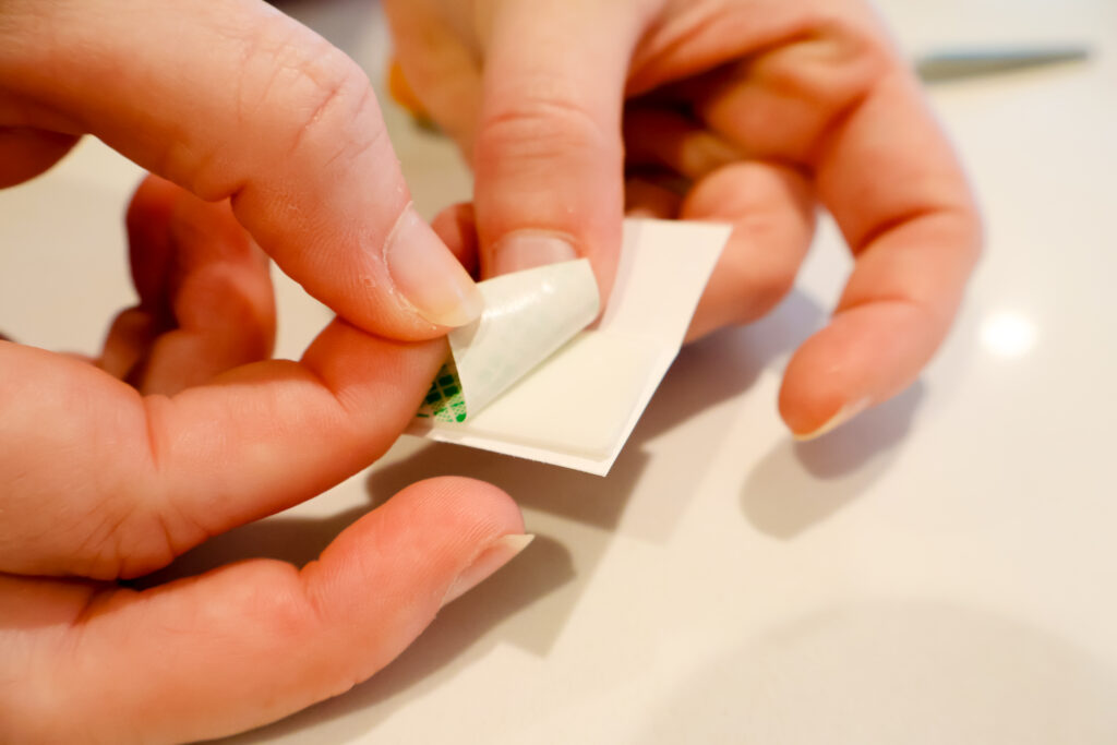 taping paper books for an ornament