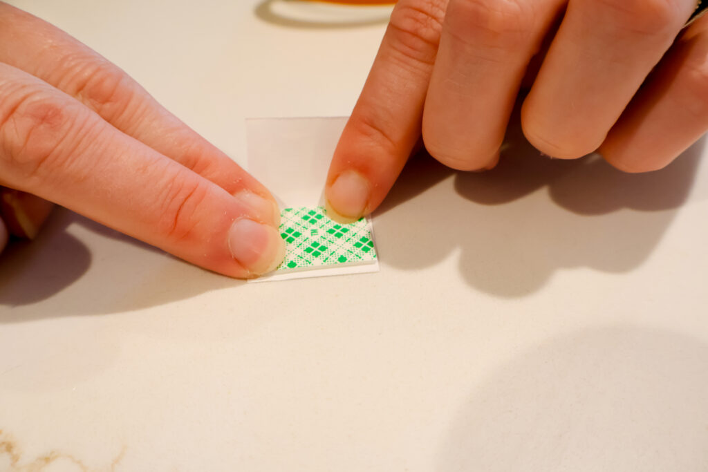 taping paper books for an ornament