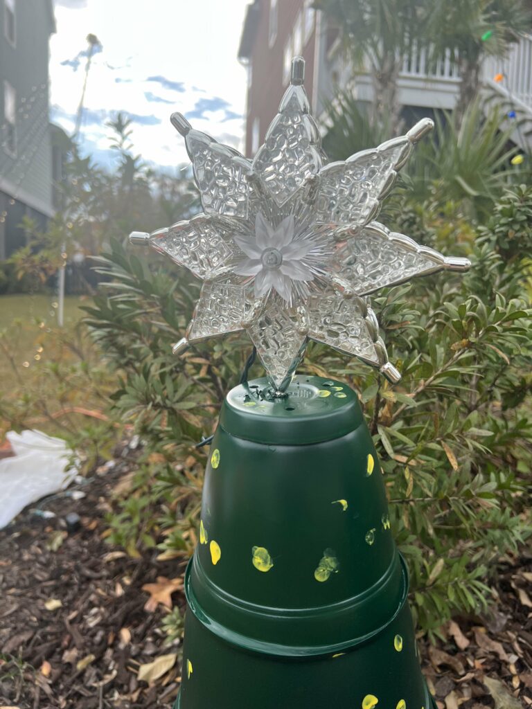 christmas tree topper on a pot tree