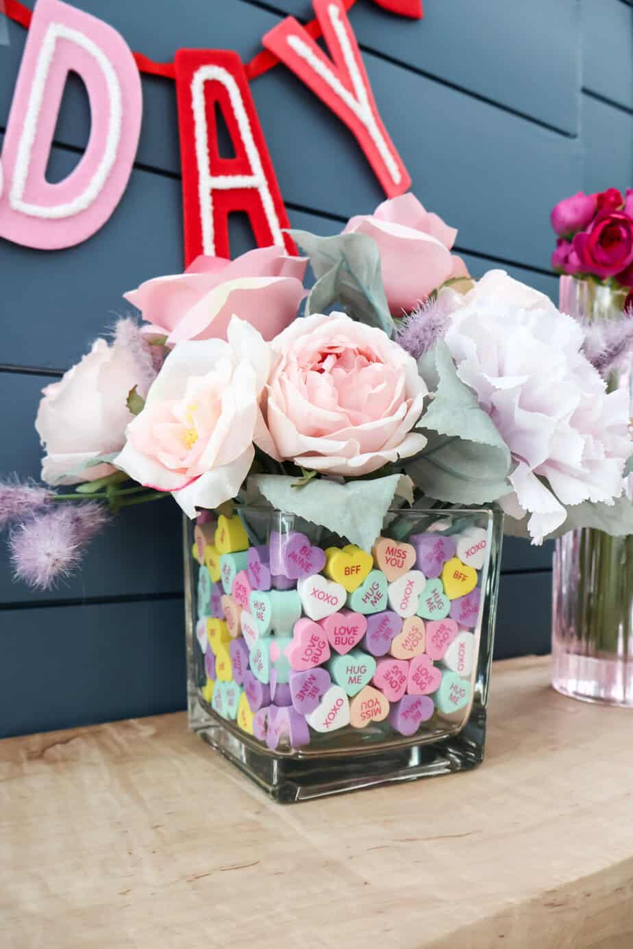 valentines day floral and candy heart centerpiece