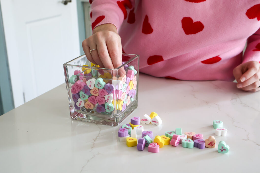 adding faux candy hearts to a vase