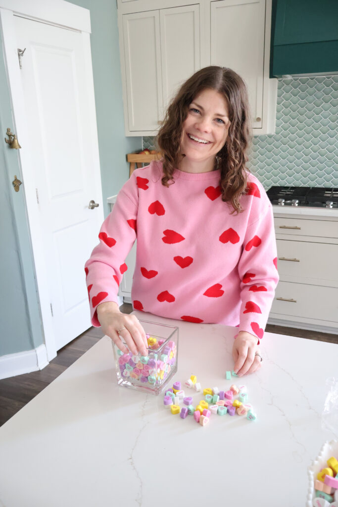 adding faux candy hearts to a vase