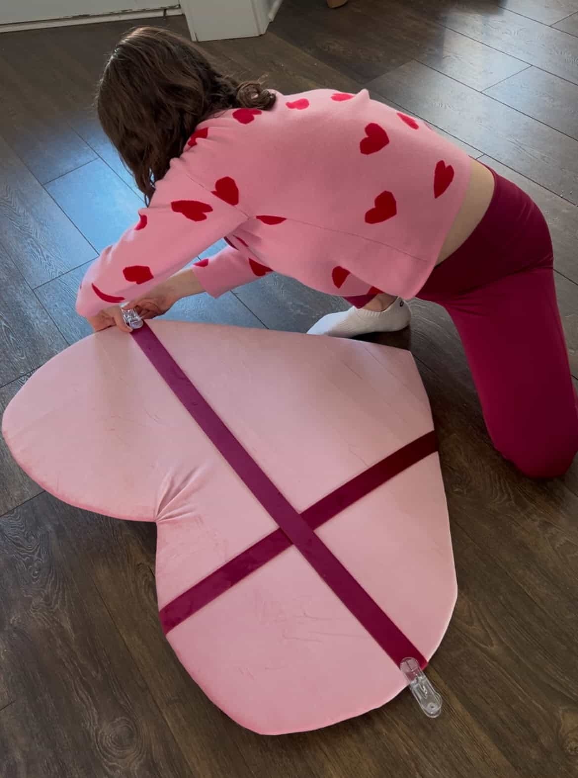 adding ribbon to giant wall hanging heart