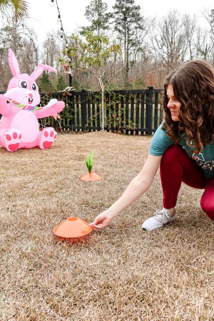 placing orange sports cone in yard