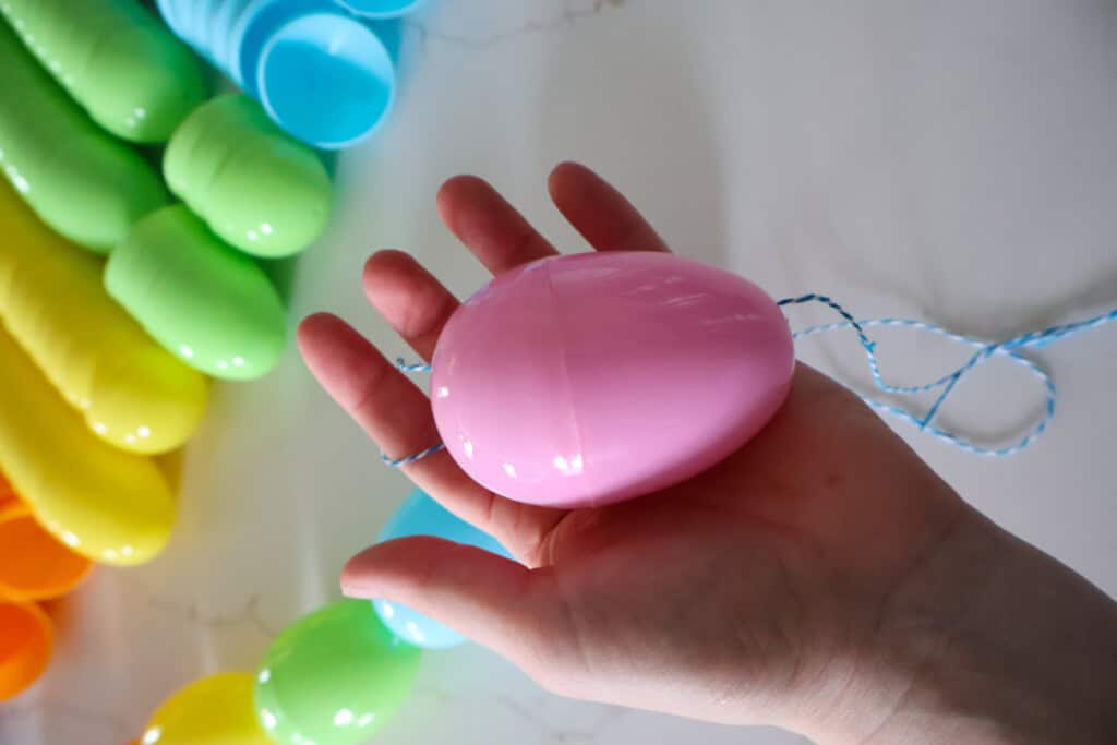 stringing easter eggs on string