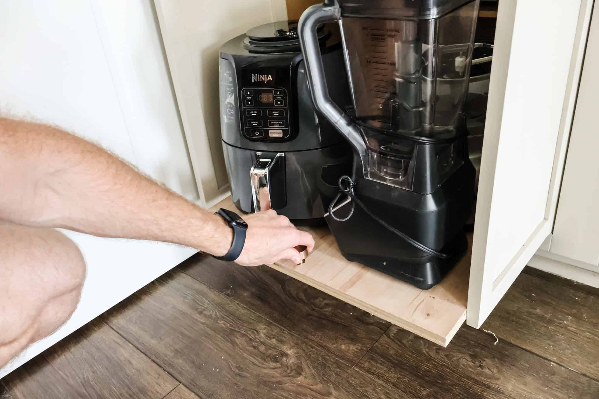 Adding handle pull to cabinet pull out tray